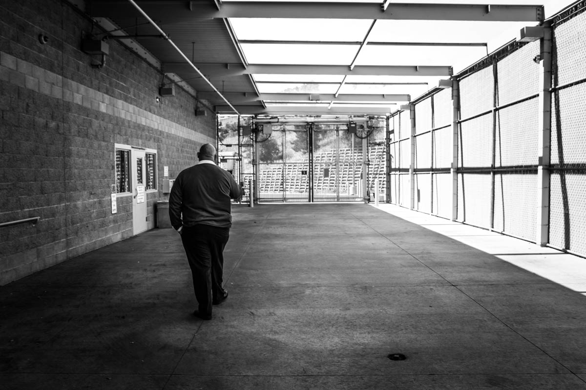 Superintendant Christian Muñoz walks through the sally port, where young people are brought into juvenile hall by police.